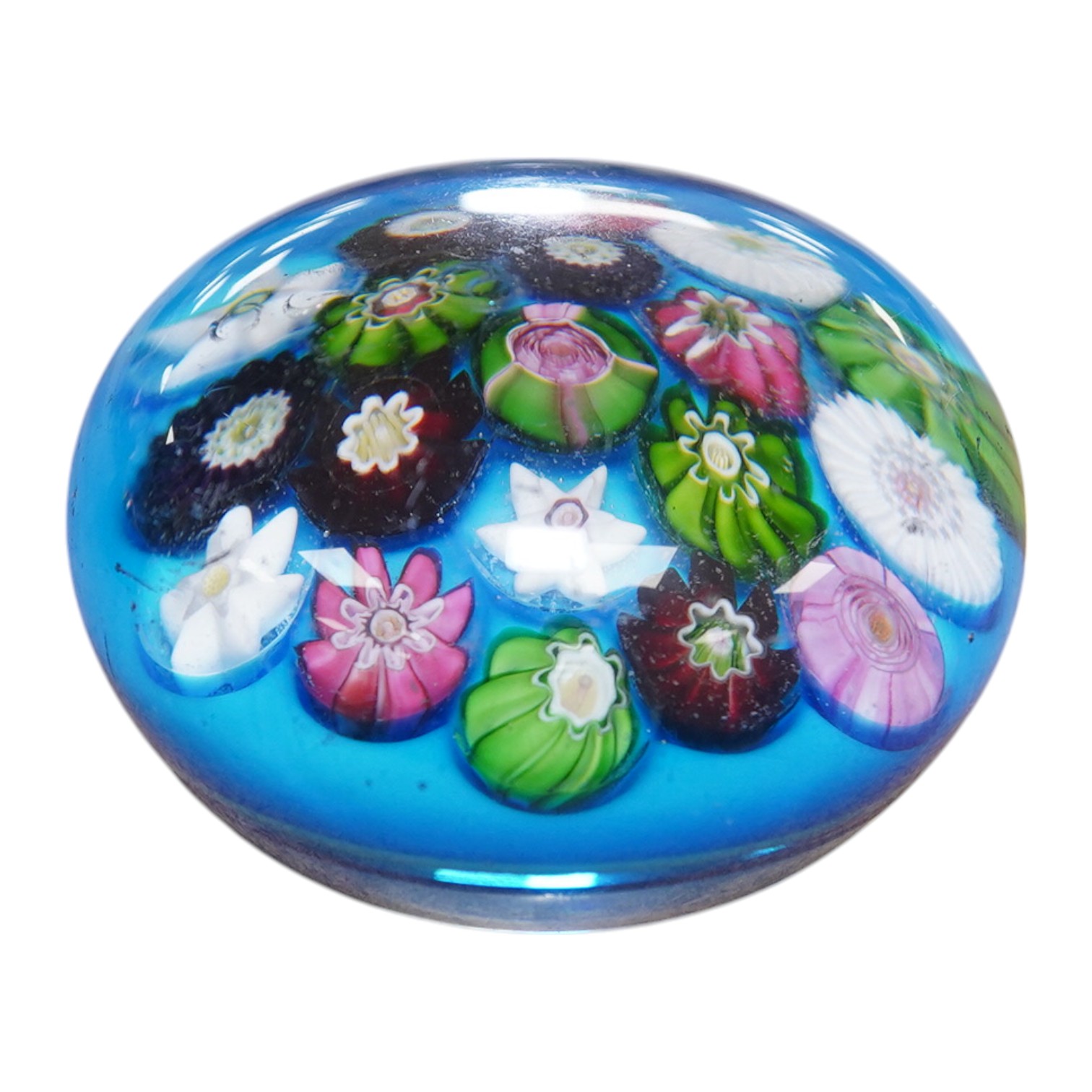 A Clichy scattered millefiori blue ground paperweight, mid 19th century, 7cm. Condition - poor to fair, impact damage